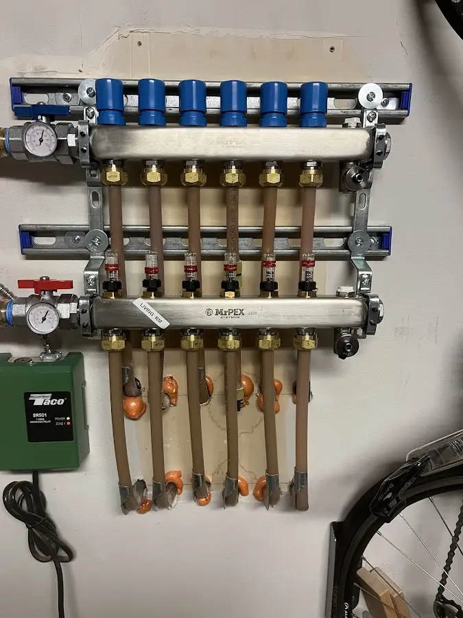 Plumber performing Water Heater Repair at a residential property in Oakland